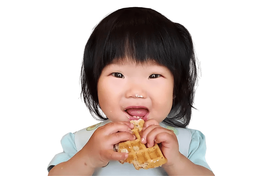 An illustrated toddler eating at the table